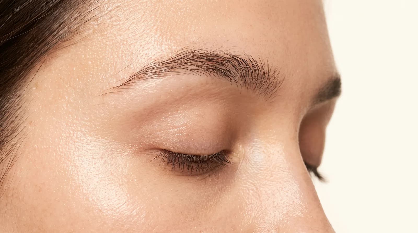 Natural eyebrow in warm ivory light