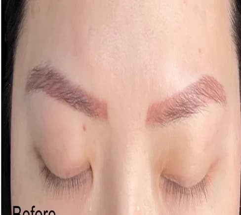 Warm saturated brow tattoo — before removal, real client